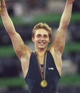Aug 1992:  Vitali Scherbo of the Eastern Unified Nations celebrates winning the Gold Medal for the Individual Combined Exercises in the Gymnastics event at the 1992 Olympic Games in Barcelona, Spain. Scherbo won with 59.025 points.  Mandatory Credit: Shaun  Botterill/Allsport