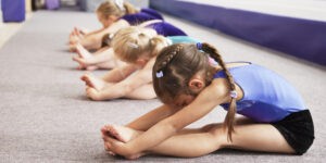 young gymnasts performing warming up routine